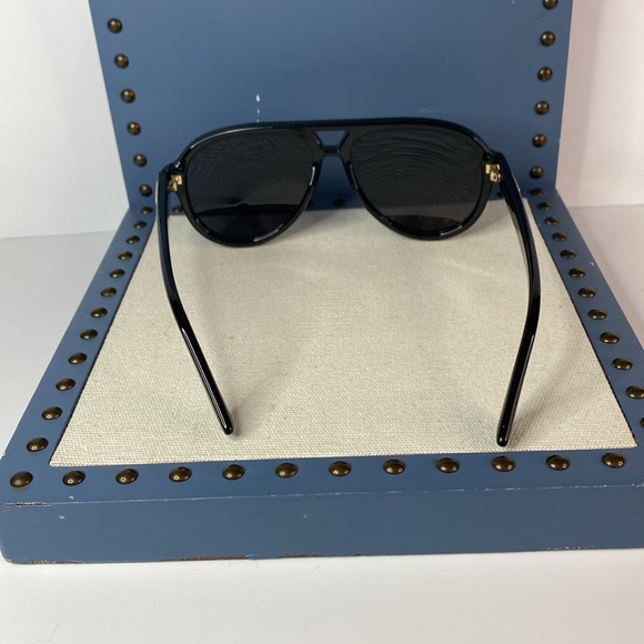 GUCCI GG0767S aviator sunglass comes in a shiny black frame with grey lenses. - Picture 7 of 14